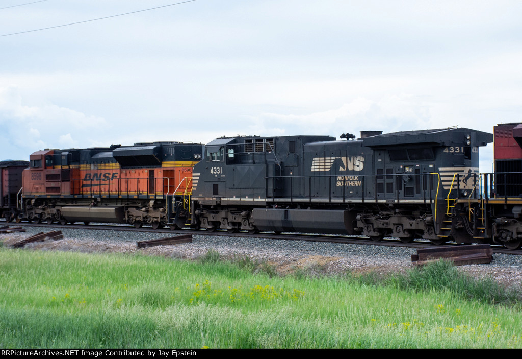 NS 4331 and a BNSF ACe trail on a westbound coal train